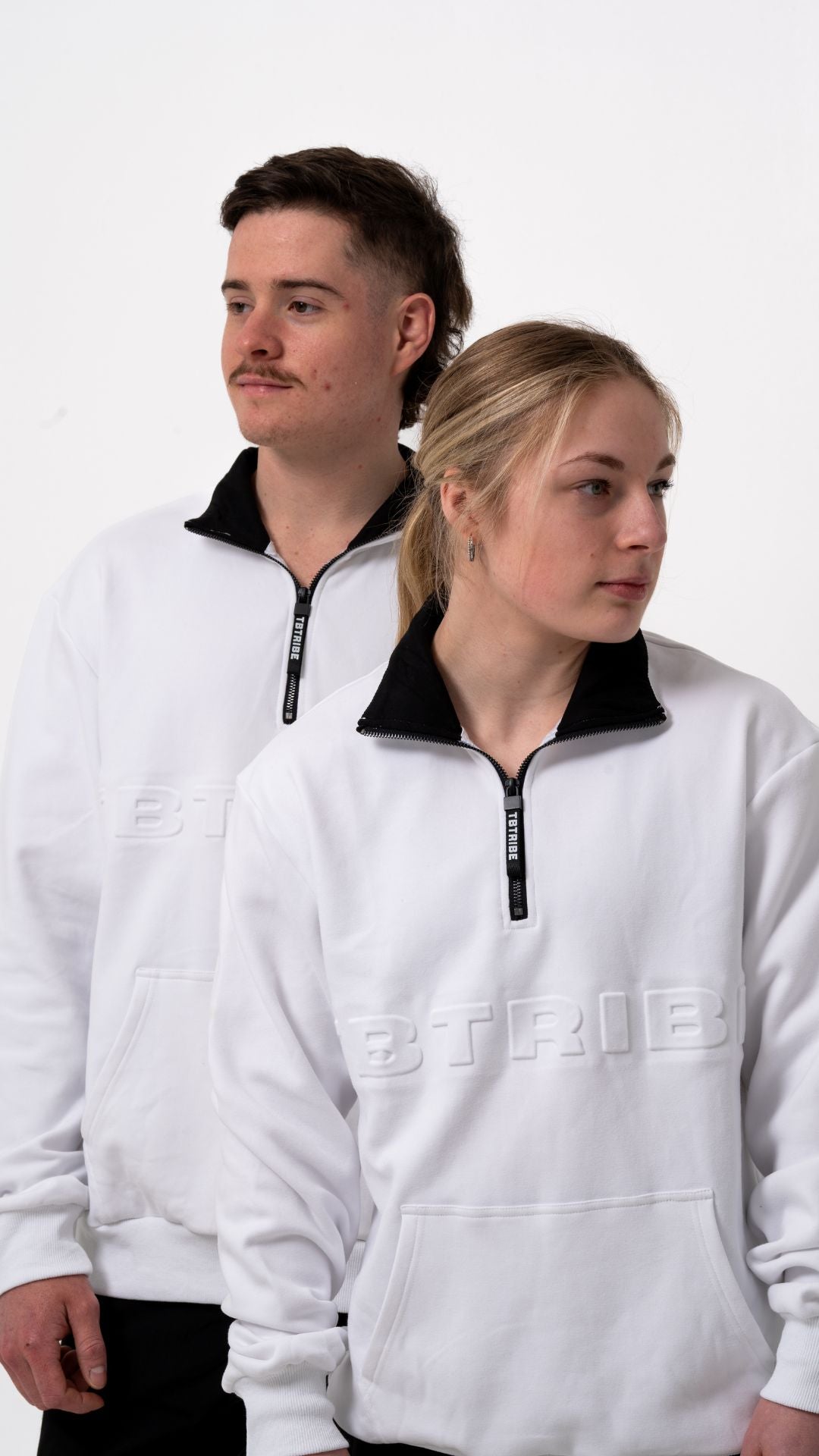 Oversized, white, fleece lined jumper with emboassed TB TRIBE logo, branded zipper tab, middle pocket and metal zipper