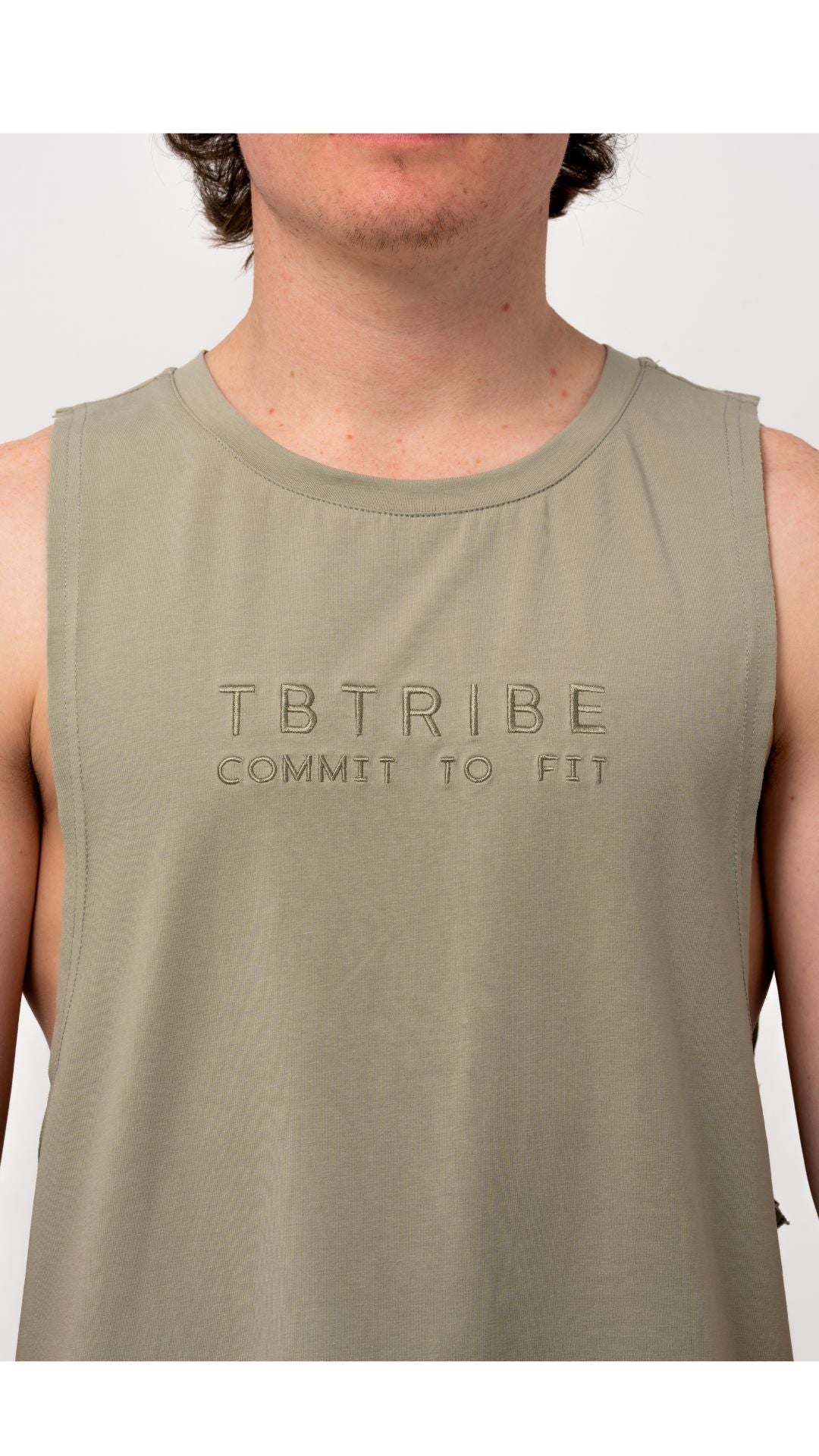 olive green colour, muscle up tank, with embroidered black logo in the middle of the chest. For gym ,training, weights, crossfit