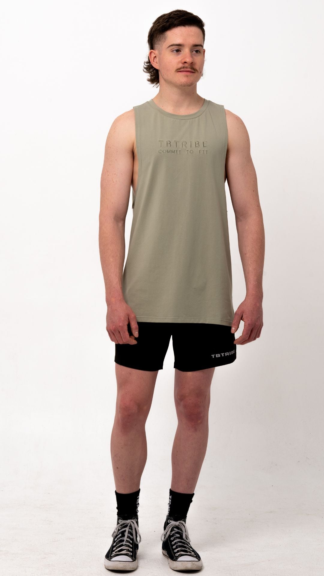 olive green colour, muscle up tank, with embroidered black logo in the middle of the chest. For gym ,training, weights, crossfit